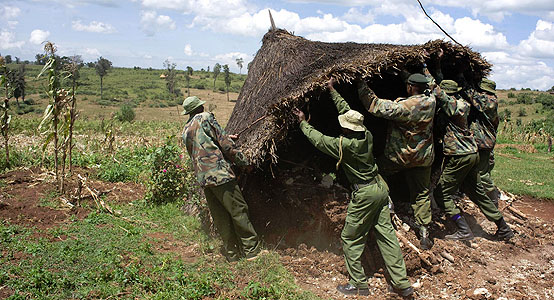 Kenya Forest Service  guards destroy Sengwer home. 